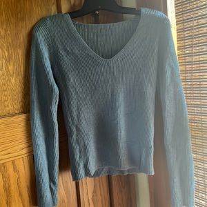 Blue cropped V-neck sweater